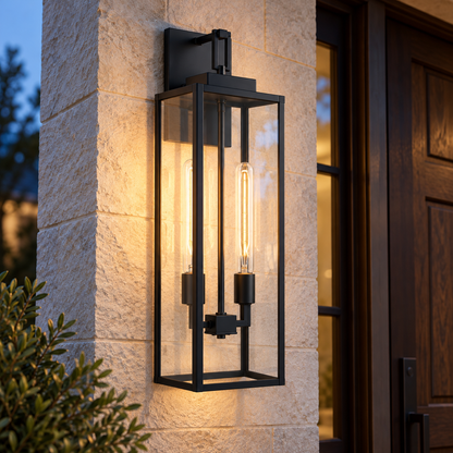 Two-light matte black outdoor wall lantern with clear glass beside a wood entry door